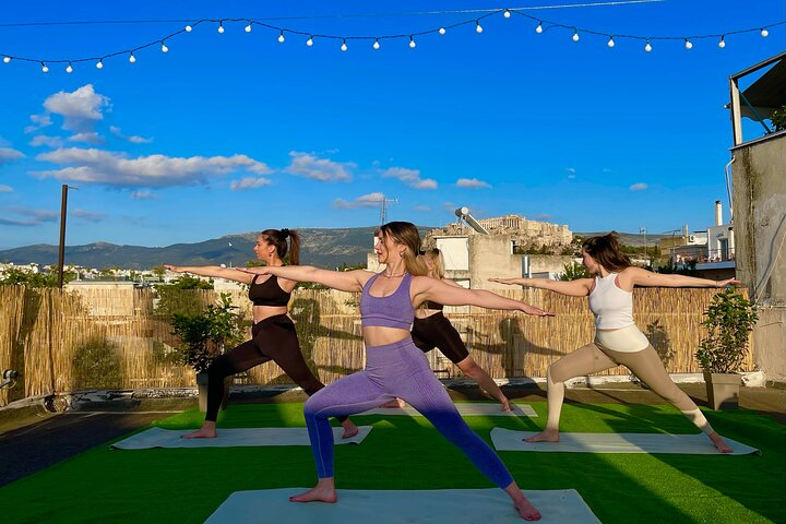 Breathe deeply as you stretch under the Athenian sky surrounded by the iconic Acropolis view. Recharge with fresh fruit and tea while savoring the sunset's beauty before strolling through charming streets.