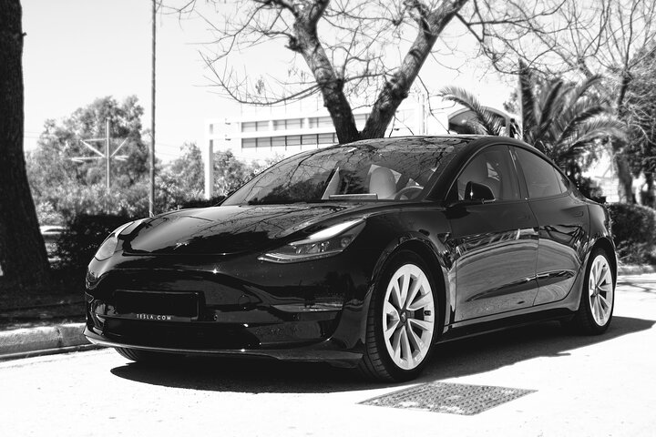 Experience luxurious travel with a Tesla from Athens Airport to the city ensuring a smooth journey through scenic landscapes with professional chauffeurs at your service.
