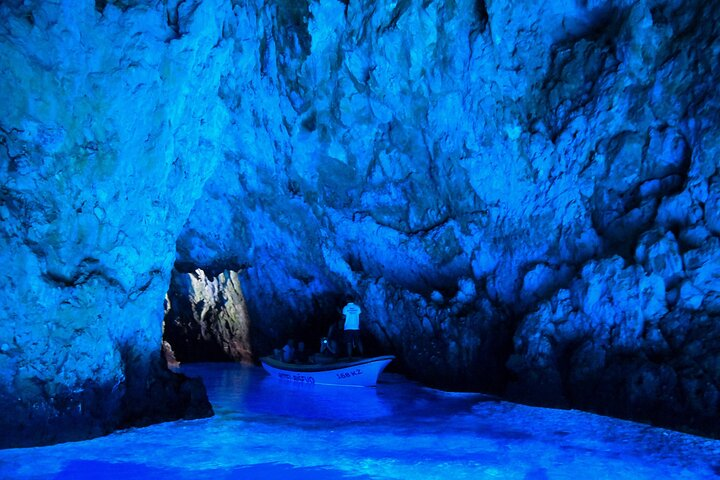 Blue Cave - the rays of sun are passing into the cave through a small crack in the ceiling which creates incredible light effects