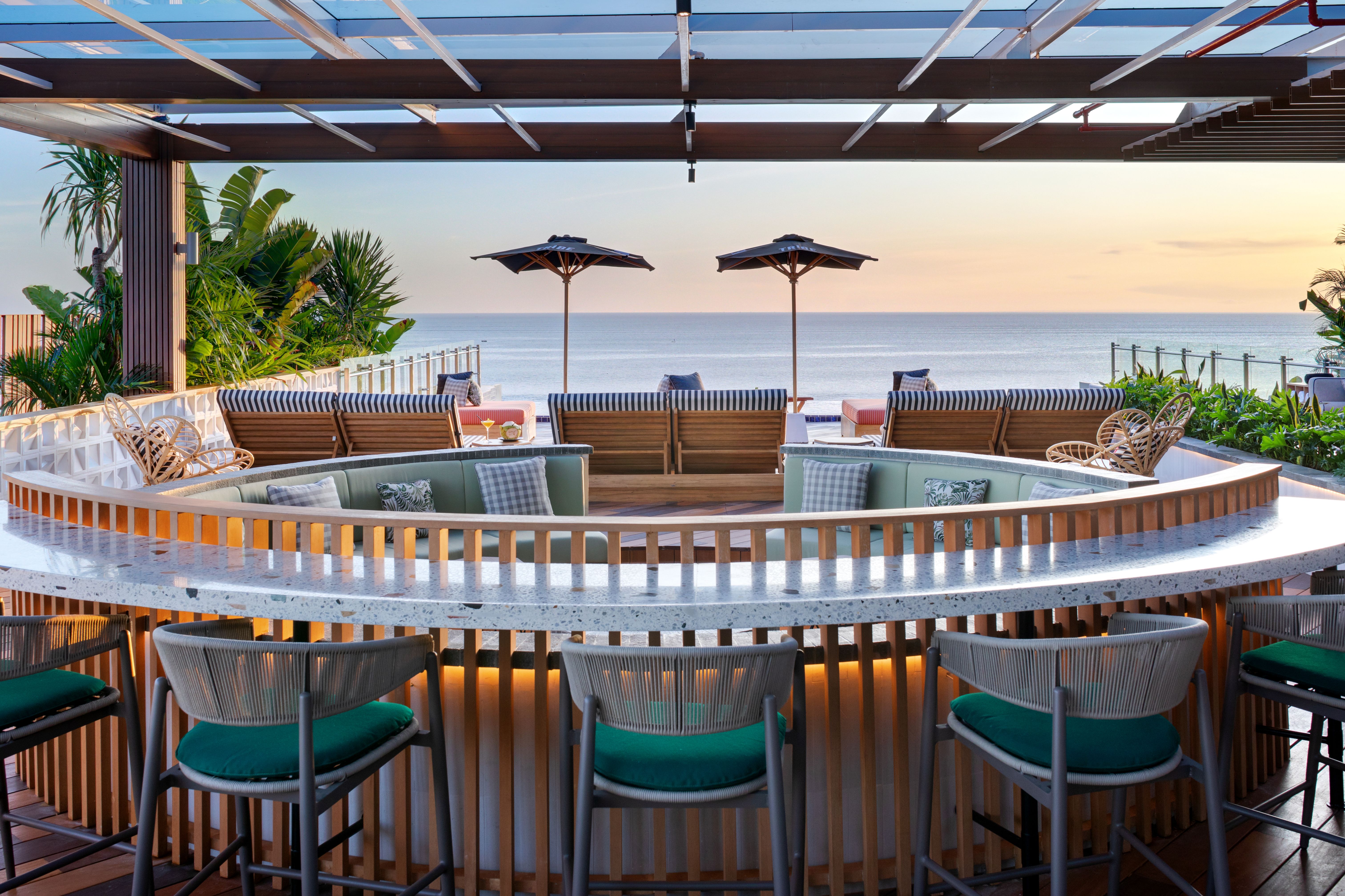 Savor sunset views at Afterglow Bar & Kitchen where beachside relaxation meets lively evenings filled with delicious food refreshing drinks and the sound of waves. Perfect for any traveler’s itinerary.