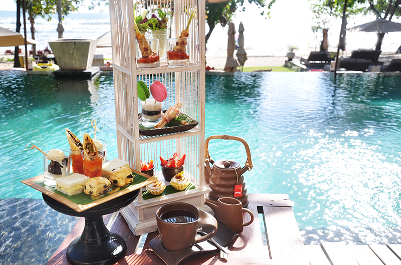 Savor delectable treats and refreshing beverages while soaking in the serene beauty of Seminyak Beach at sunset creating unforgettable moments in this Balinese paradise.