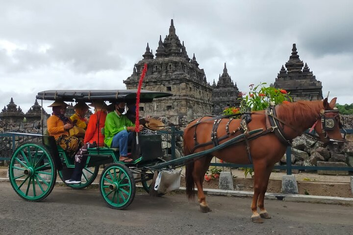 Explore Yogyakarta's rich heritage aboard an Andong enjoying picturesque views of ancient temples while immersing in local life and trying honey straight from the hive.