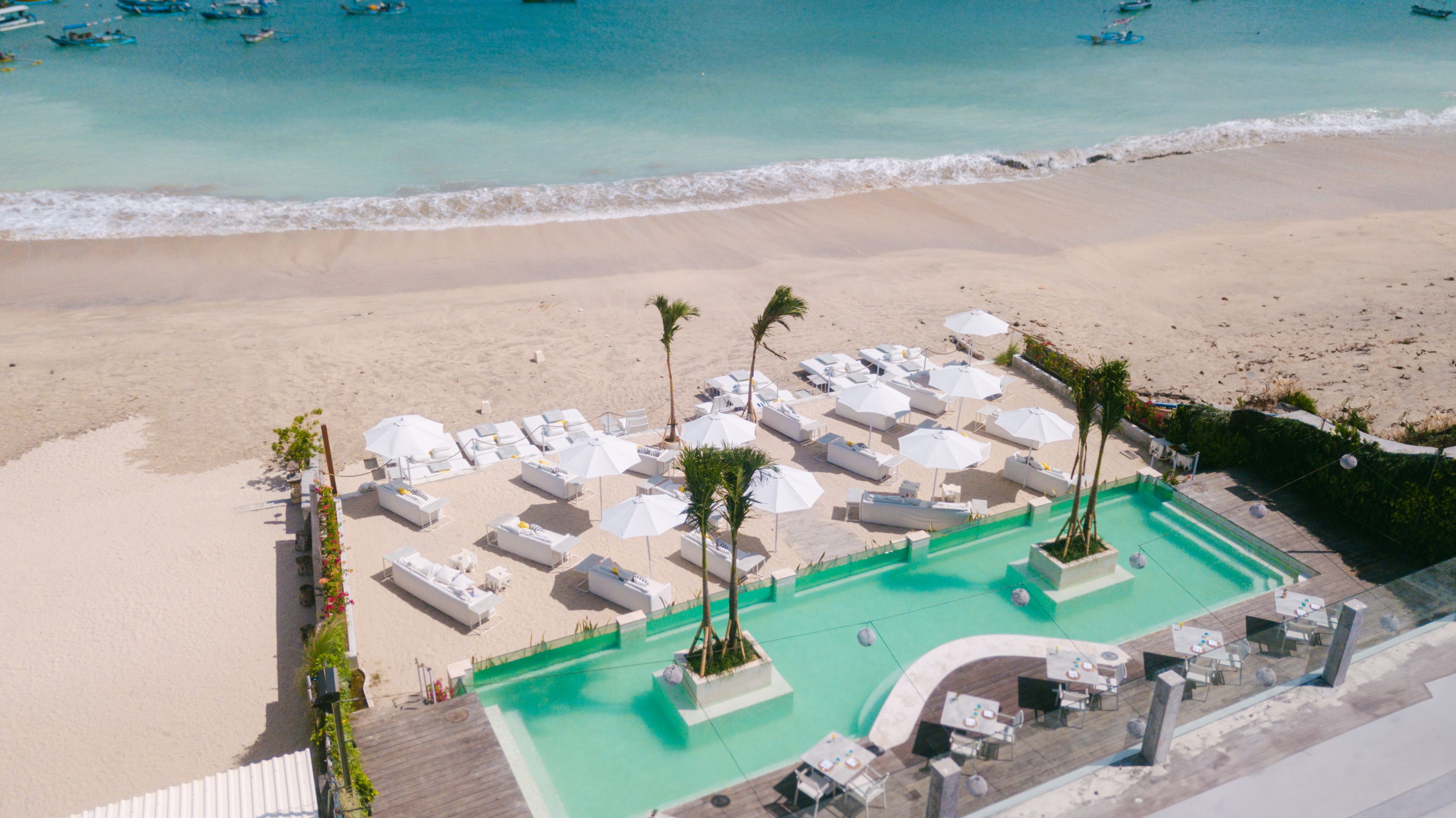 Immerse yourself in the serene beauty of Jimbaran's coastline at Azure Beach Restaurant where fresh seafood and stunning ocean views create the perfect getaway for relaxation and culinary delight.