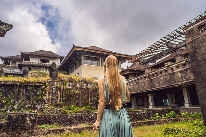 Explore the eerie charm of Bali's biggest abandoned hotel. Discover its haunting beauty surrounded by lush greenery while uncovering hidden gems like Ulun Danu Temple and Banyumala waterfall.