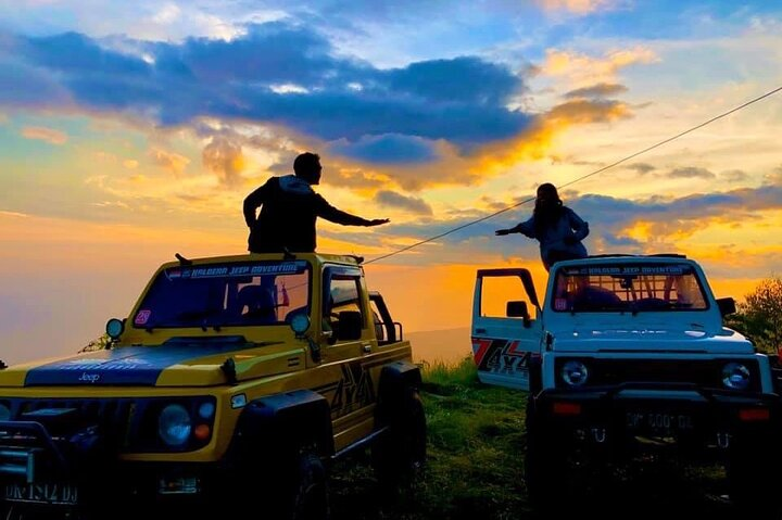 Experience a breathtaking sunrise over Mount Batur surrounded by volcanic landscapes. Journey in a 4x4 jeep and unwind in natural hot springs tasting local delights along the way.