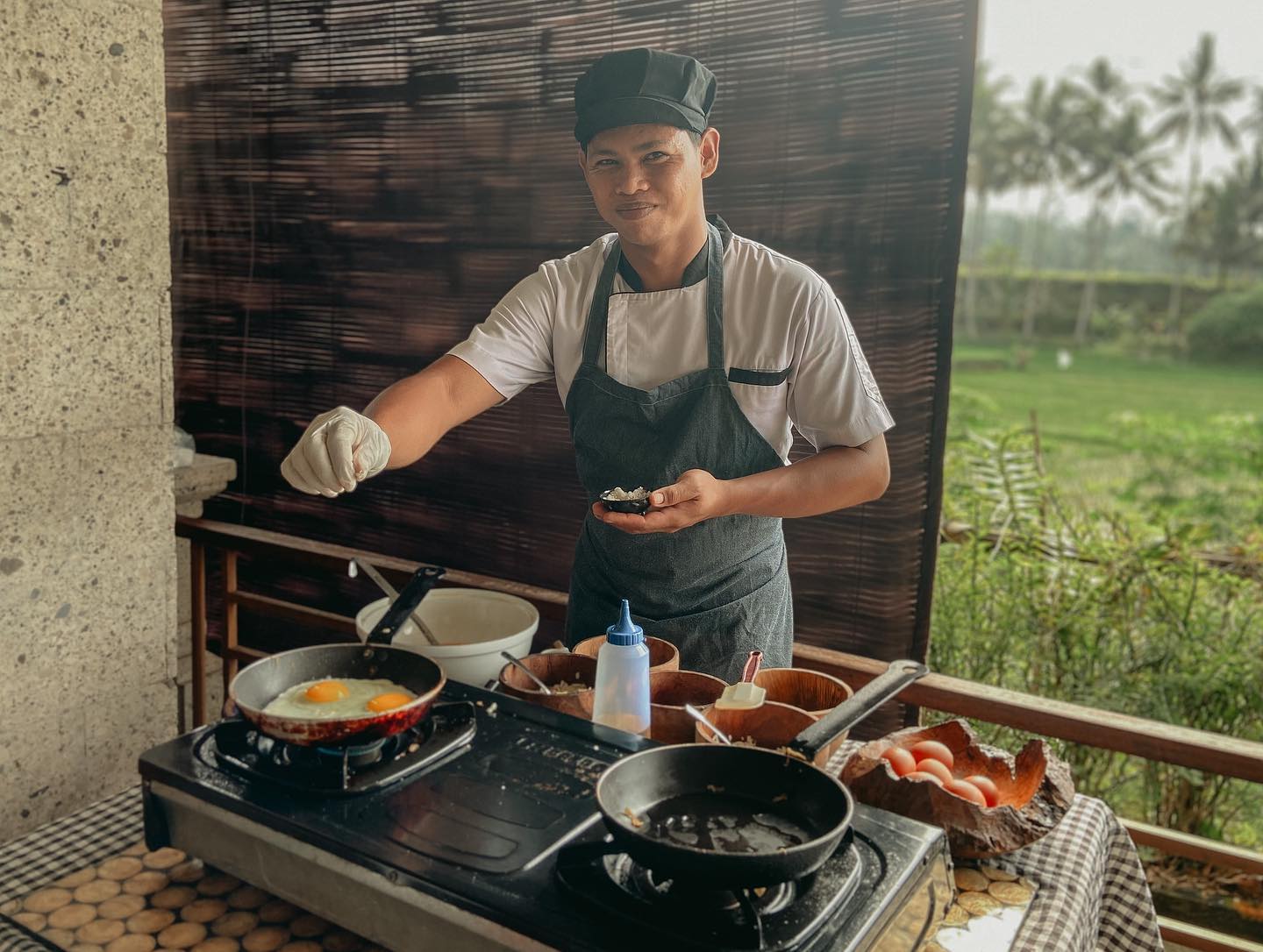 Experience the joy of cooking authentic Balinese cuisine at Om Ham Retreat surrounded by lush greenery. Engage with a skilled chef and savor the delights of your culinary creations.