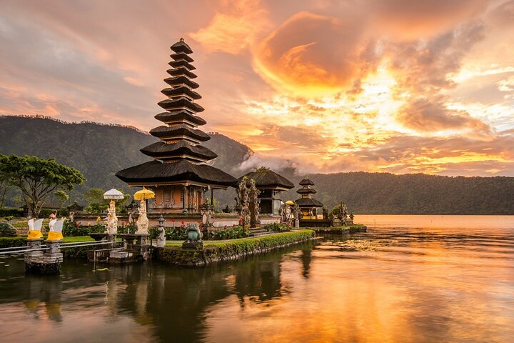 Ulun Danau Beratan Temple sits on Lake Beratan's western side against a backdrop of Bedugul’s highland mountains, a popular weekend getaway for locals. 