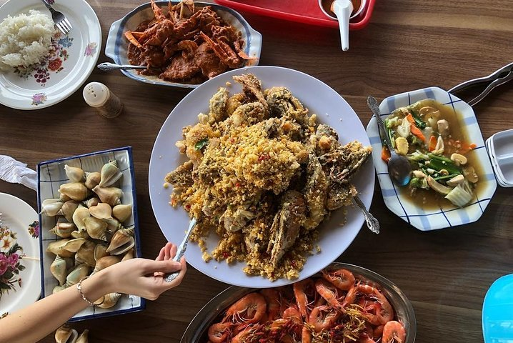 Savor the delightful flavors of Batam with a feast featuring fresh local seafood and traditional dishes making every meal a memorable highlight of your island adventure.