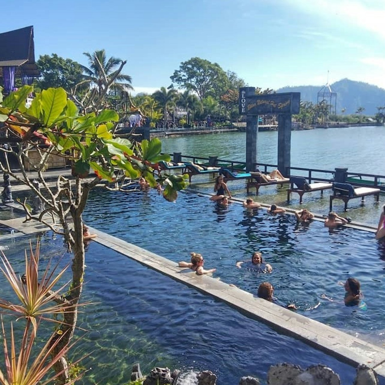 Relax in the warm thermal waters of Batur Natural Hot Spring surrounded by stunning mountain views. A serene escape perfect for rejuvenation and unwinding in Bali.
