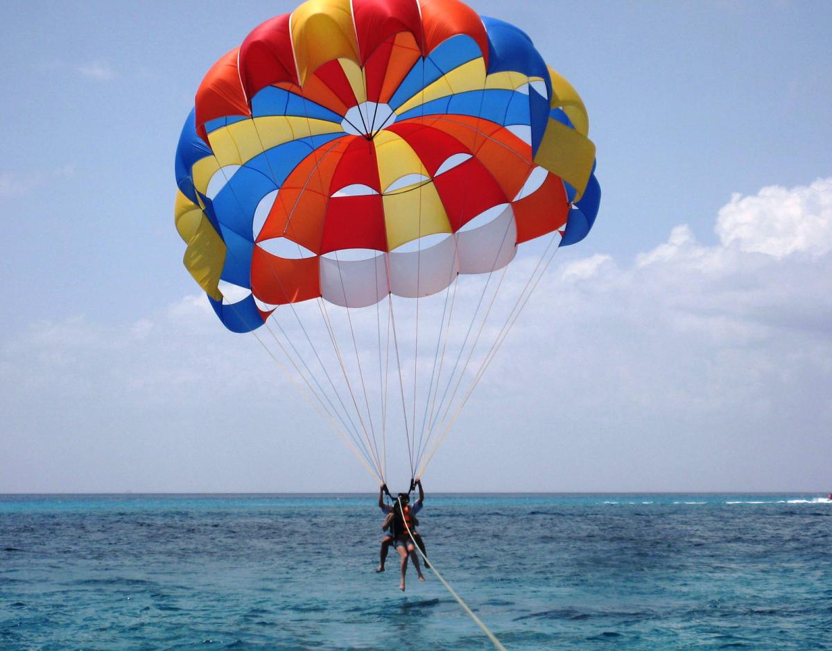 Experience the thrill of parasailing over Bali's stunning coastline where the waves meet the sky and unforgettable memories are made. Adventure awaits at Tanjung Benoa Water Activities!