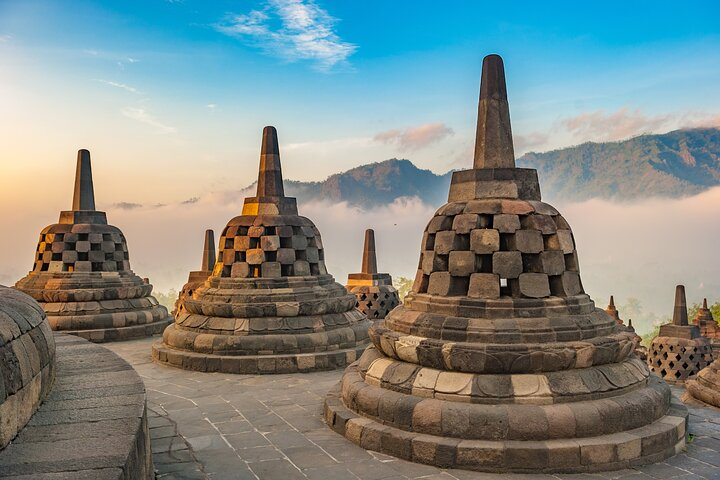 Explore the majestic Borobudur Temple where stunning sunrise views and intricate stone stupas create an unforgettable experience. Perfect for travelers seeking adventure in Yogyakarta's rich cultural landscape.