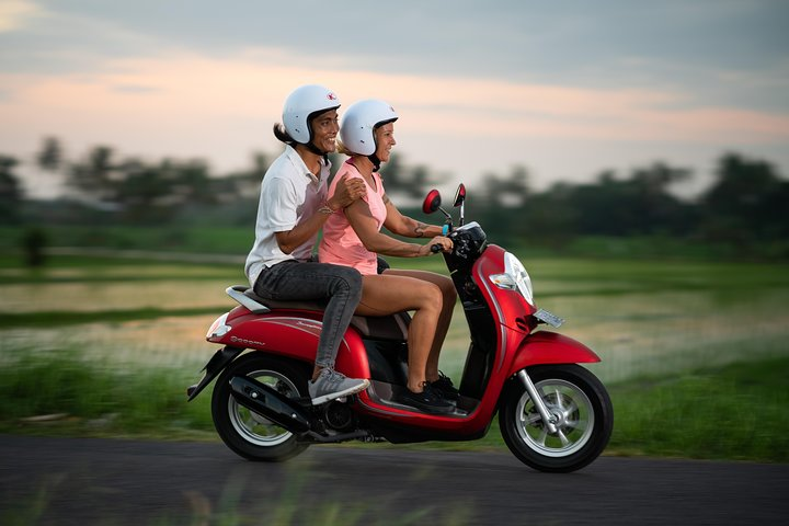Experience Bali like a local on a scooter navigating scenic roads and lush landscapes with confidence while enjoying the freedom and joy of exploring this beautiful island.