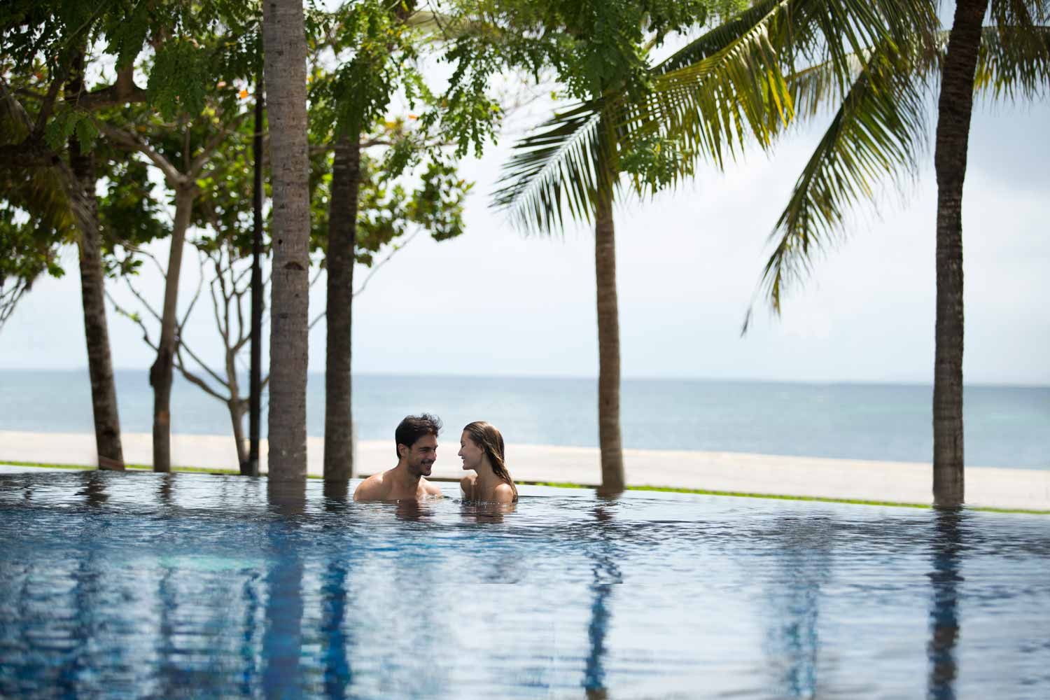 Savor exquisite dining by the ocean at The Royal Santrian where the peaceful beach and luxurious surroundings create a perfect backdrop for memorable moments and culinary delights.