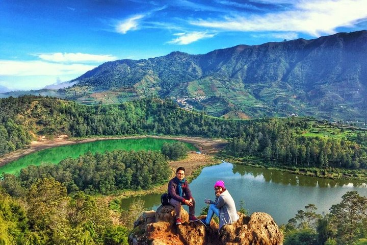 Explore the stunning landscapes of Dieng Plateau where rolling green hills meet colorful lakes and majestic mountains creating a perfect backdrop for your adventures in Central Java.