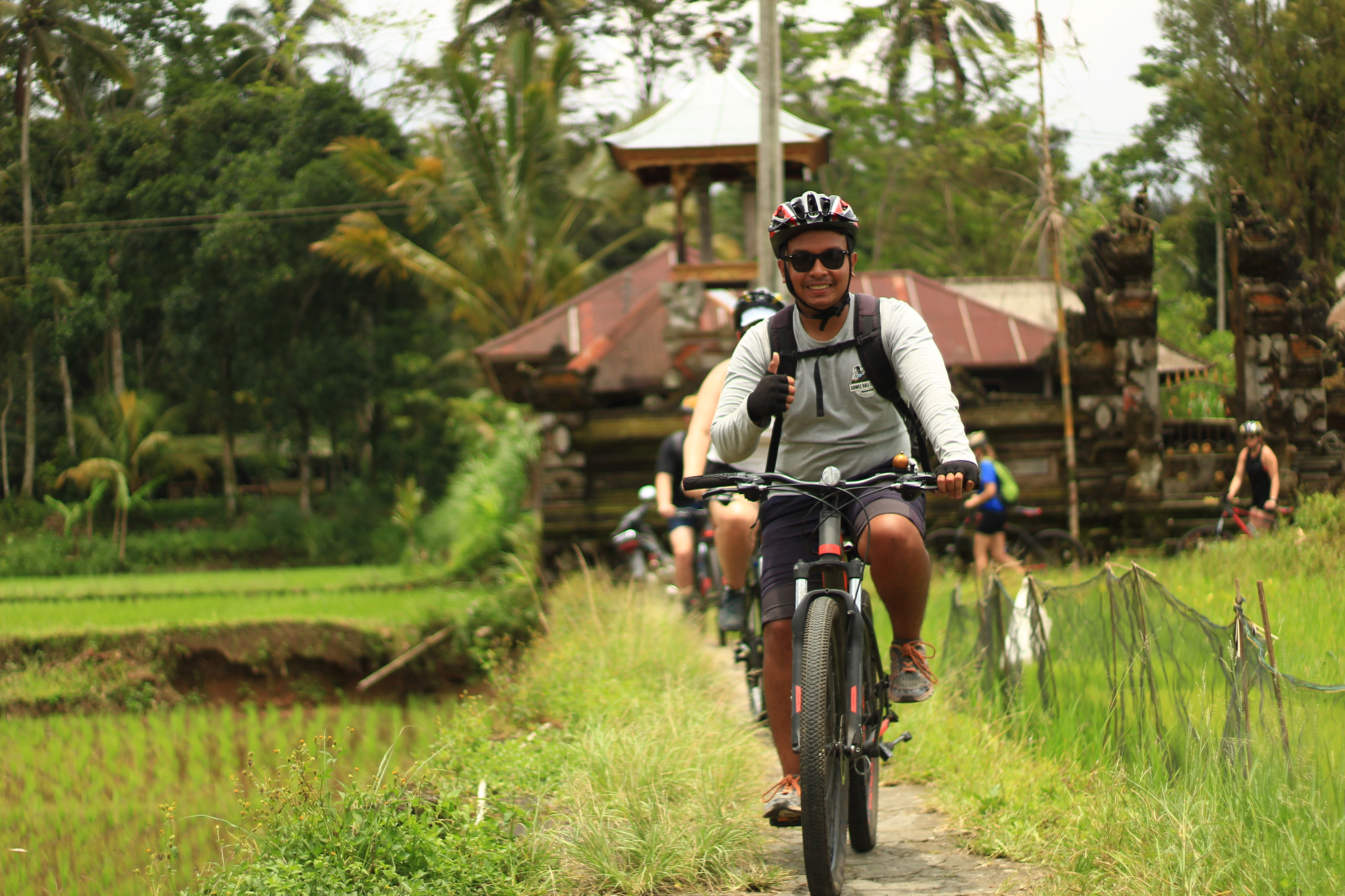 Explore the stunning landscapes of rural Bali while cycling through lush rice paddies and traditional villages immersing yourself in the rich local culture and scenic beauty.