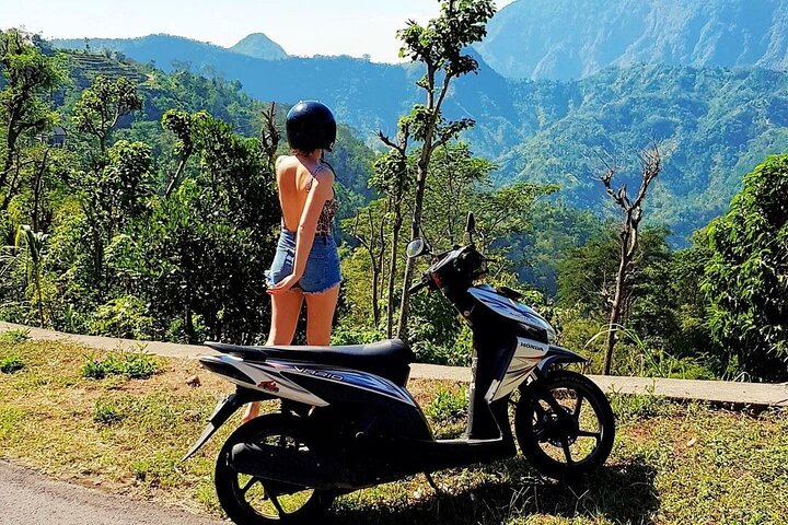 Experience the serene beauty of Sidemen Valley as you ride through lush green landscapes with breathtaking views of Mount Agung and charming rural life unfolding around you.