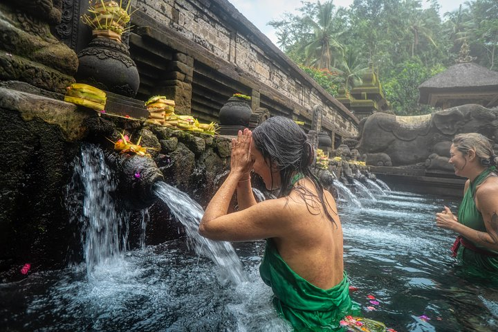 Experience spiritual renewal at Bali's Royal Water Garden where sacred waters flow amidst lush greenery. Engage in traditional rituals surrounded by stunning architecture and serene landscapes. A journey for the soul awaits.