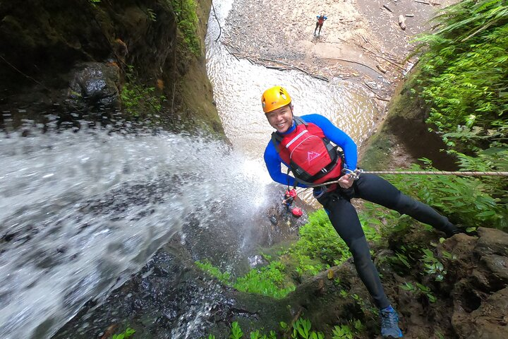 Experience the excitement of Gitgit Canyon where families can enjoy fun slides exhilarating jumps and beautiful waterfalls making canyoning accessible for everyone looking for adventure.