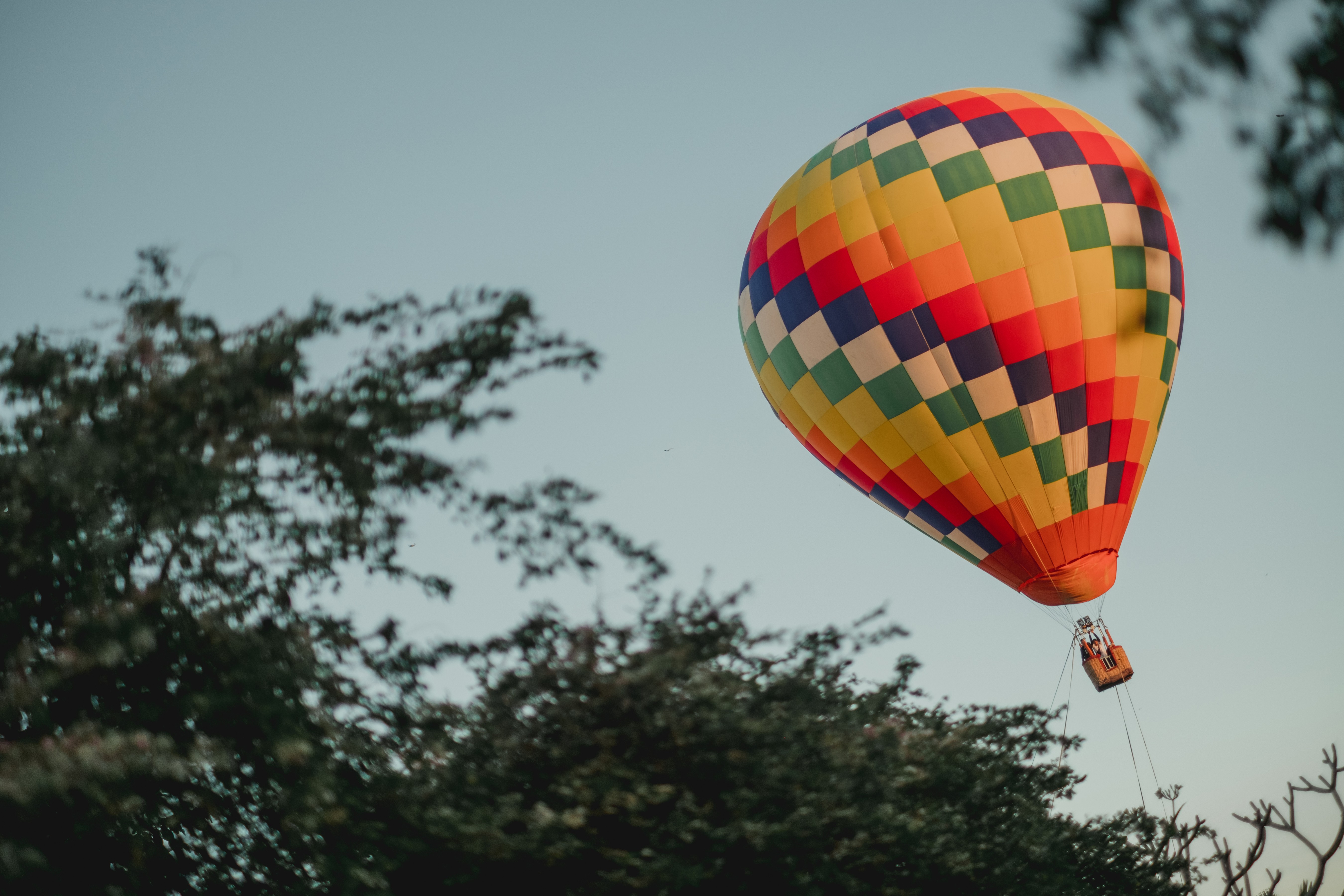 Float peacefully above Ubud’s lush rice fields in a colorful hot air balloon taking in breathtaking views of the tropical landscape and sacred Mount Agung on the horizon.