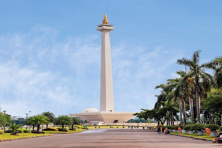 Discover the iconic National Monument surrounded by lush greenery offering a perfect glimpse into Jakarta's rich history and culture ideal for creating lasting memories with loved ones.