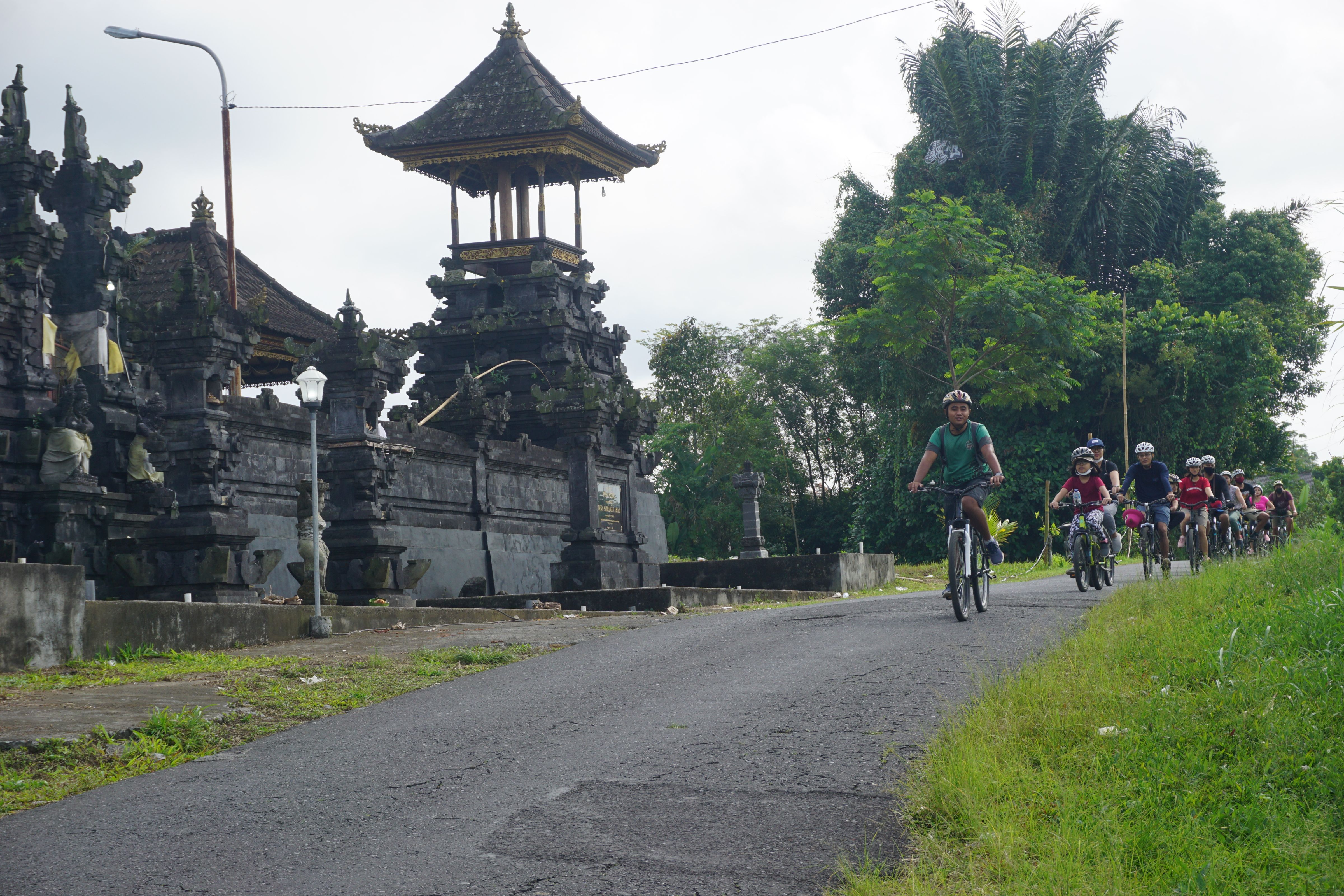 Pedal through Bali's scenic rice fields and charming villages soaking in traditional architecture and lush landscapes topped off with local coffee and a delightful meal at GreenKubu Cafe.