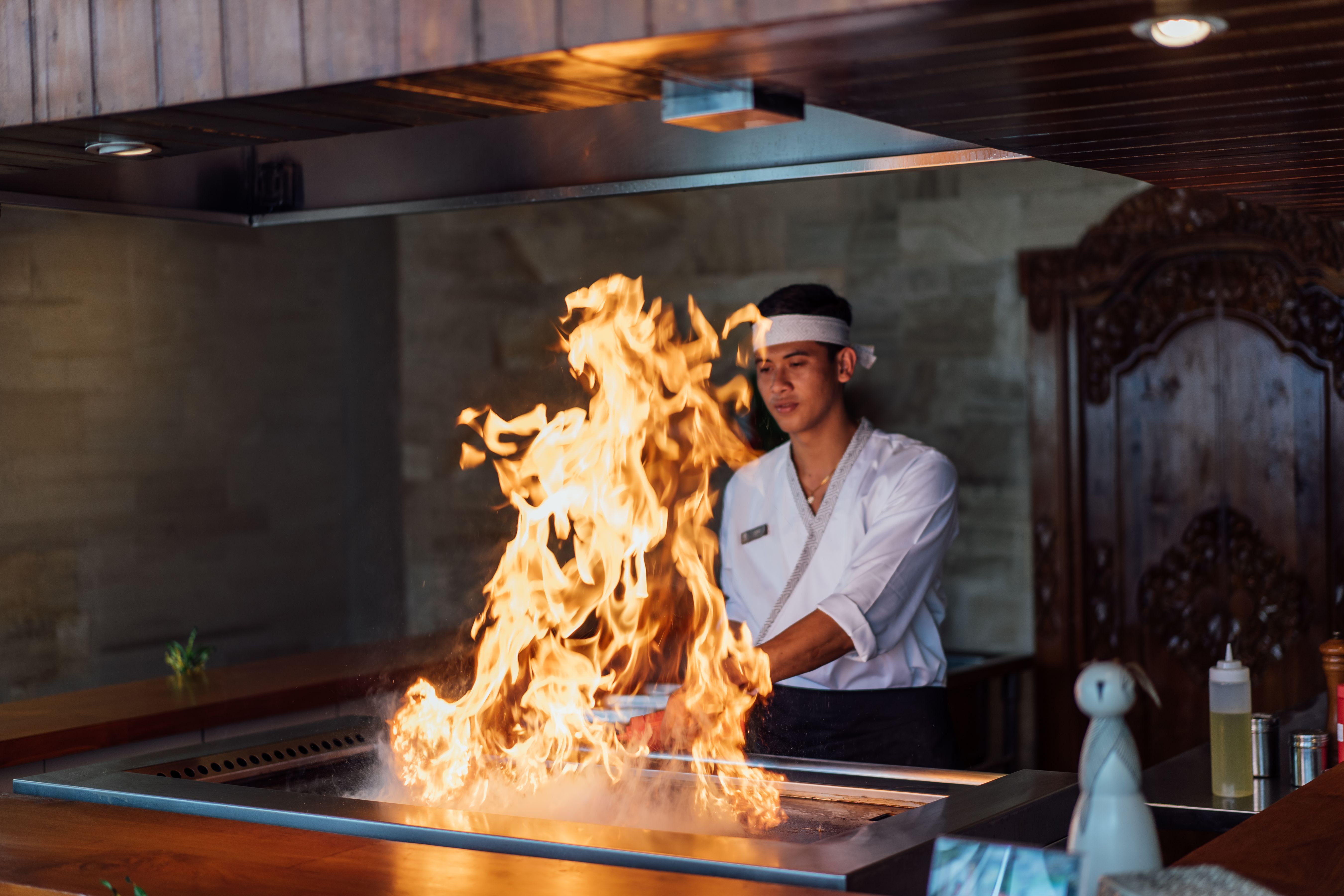 Experience the artistry of teppanyaki at Kojin Teppanyaki Omakase Restaurant where skilled chefs create flavorful dishes with a dramatic flair that transforms every meal into a memorable event.