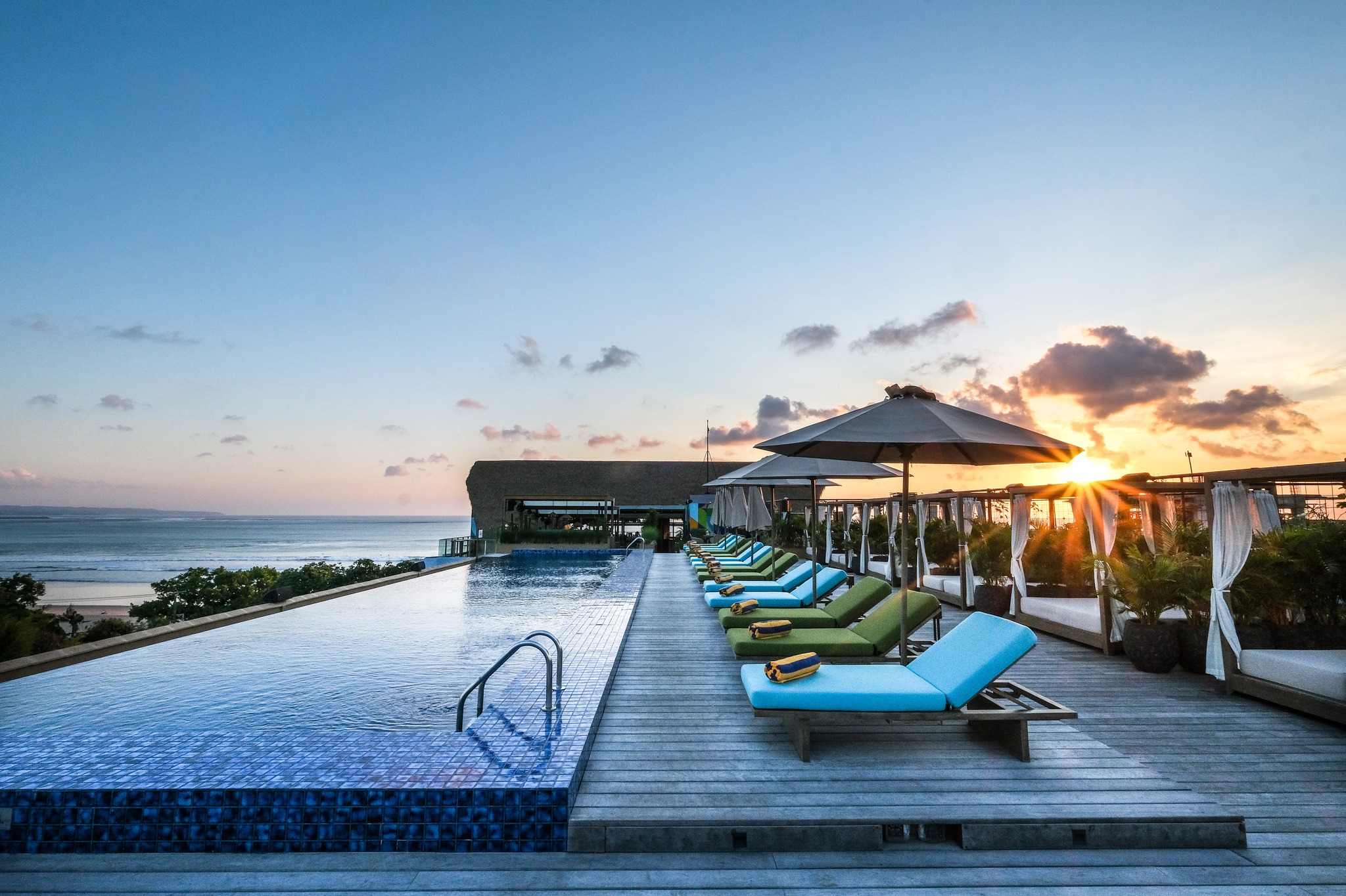 Experience breathtaking views of Kuta Beach while savoring Tipsy Tea's delightful treats and cocktails. Indulge in a playful twist on afternoon tea amidst stunning sunset reflections.