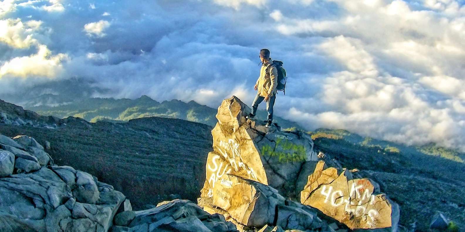 Experience the thrill of reaching the summit of Mount Agung where striking clouds meet a stunning sunrise all while enjoying a delicious breakfast in a breathtaking landscape.