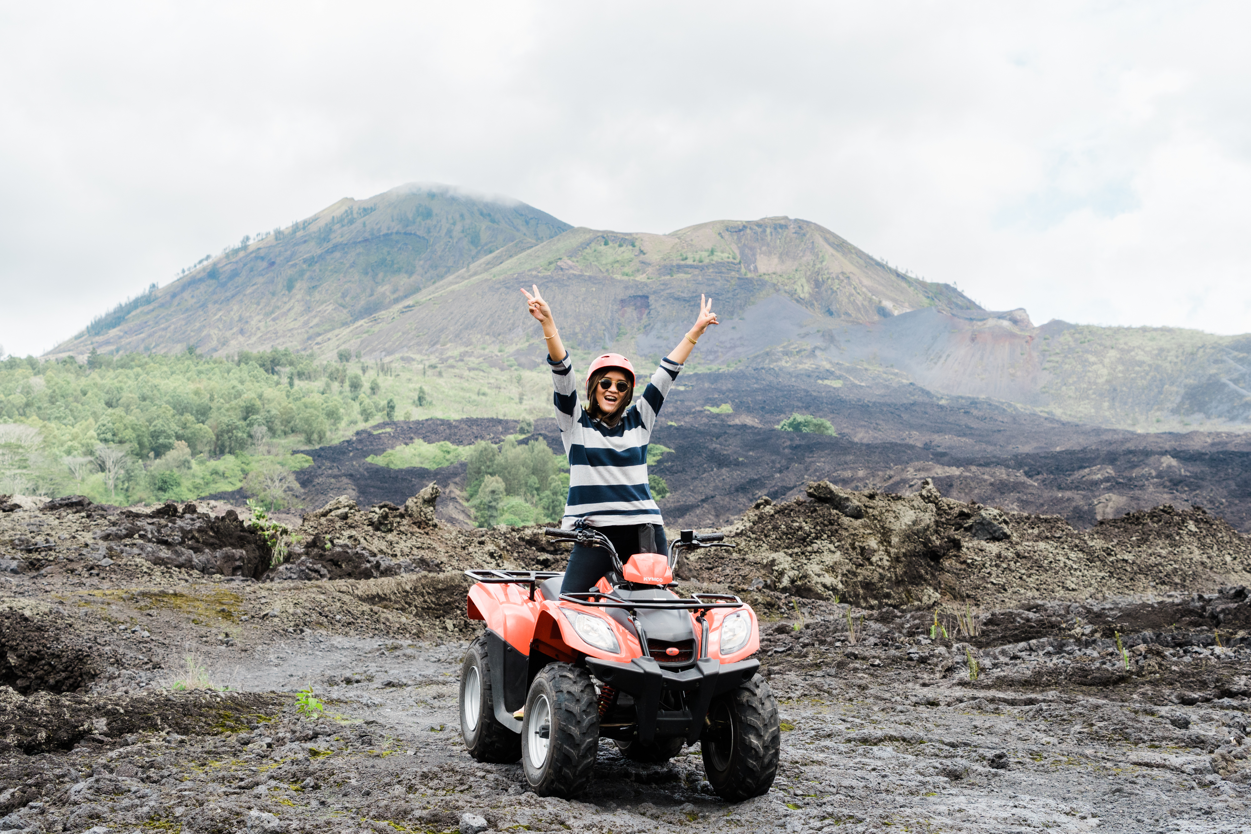 Experience the excitement of traversing black lava landscapes on a quad bike embracing the raw beauty of Mount Batur while enjoying serene views and natural wonders around every turn.