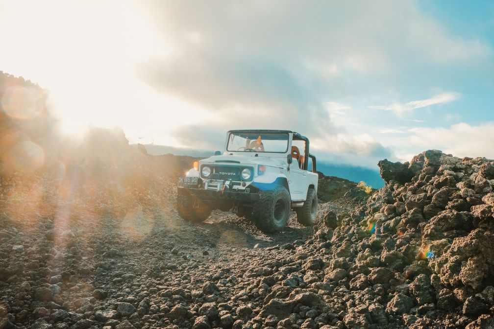 Experience the rugged beauty of Mount Batur as you traverse its unique terrain in a 4WD jeep soaking in the breathtaking views that unfold with every turn.