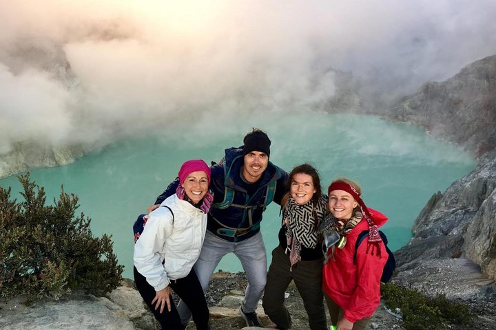 Experience the stunning beauty of Mt Ijen where friends gather to witness the unique blue fire and its mesmerizing acidic lake set against breathtaking volcanic scenery.