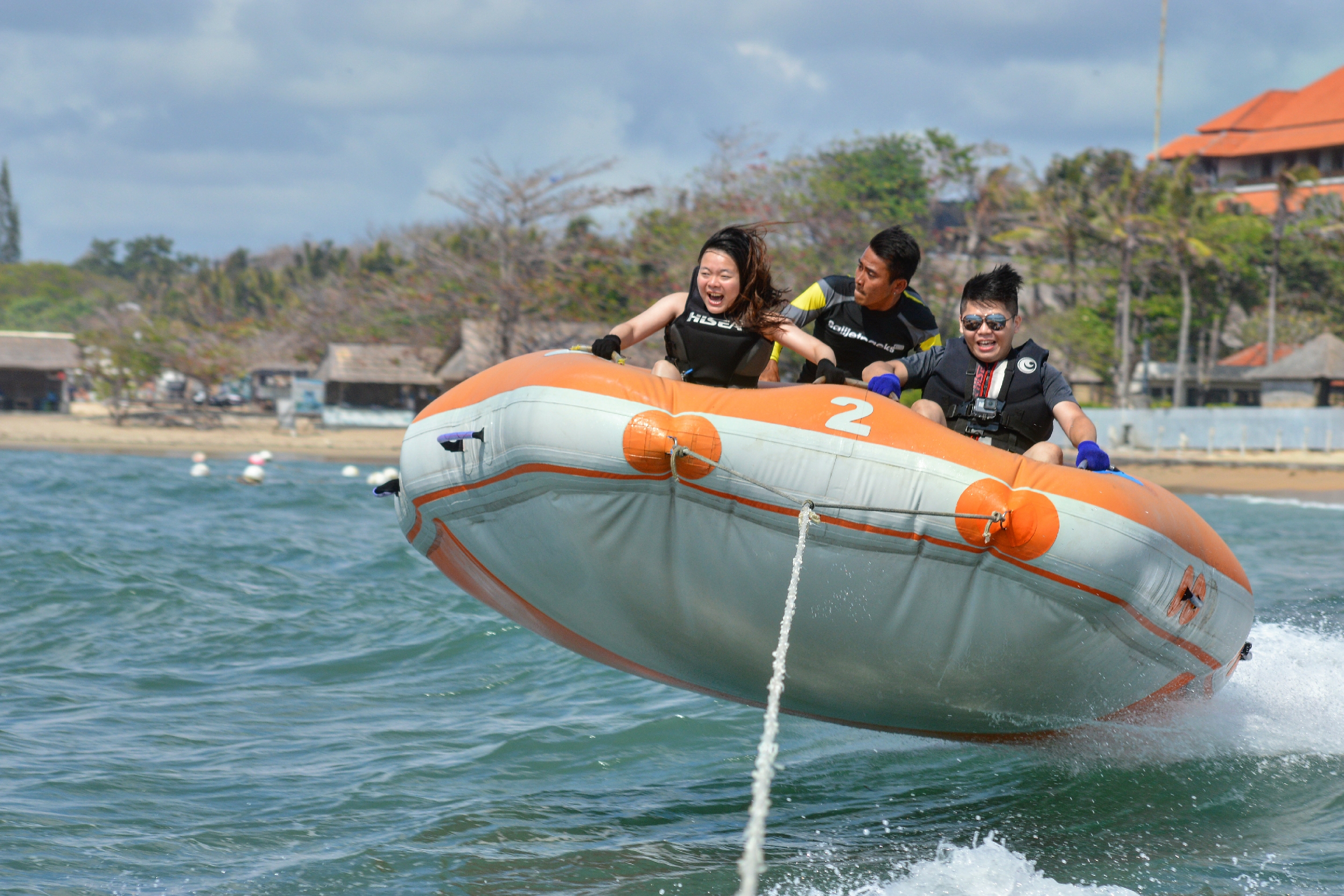 Experience the excitement of gliding over waves on a donut boat ride surrounded by the stunning Bali coastline and the invigorating breeze of Nusa Dua's beautiful sea.