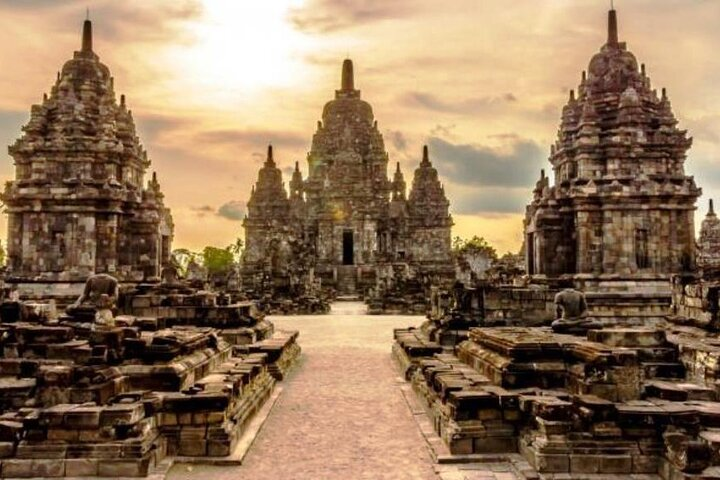 Witness the stunning silhouettes of Prambanan temple at sunset where history meets culture complemented by a delightful dinner and the magical Ramayana Ballet performance beneath the fading light.