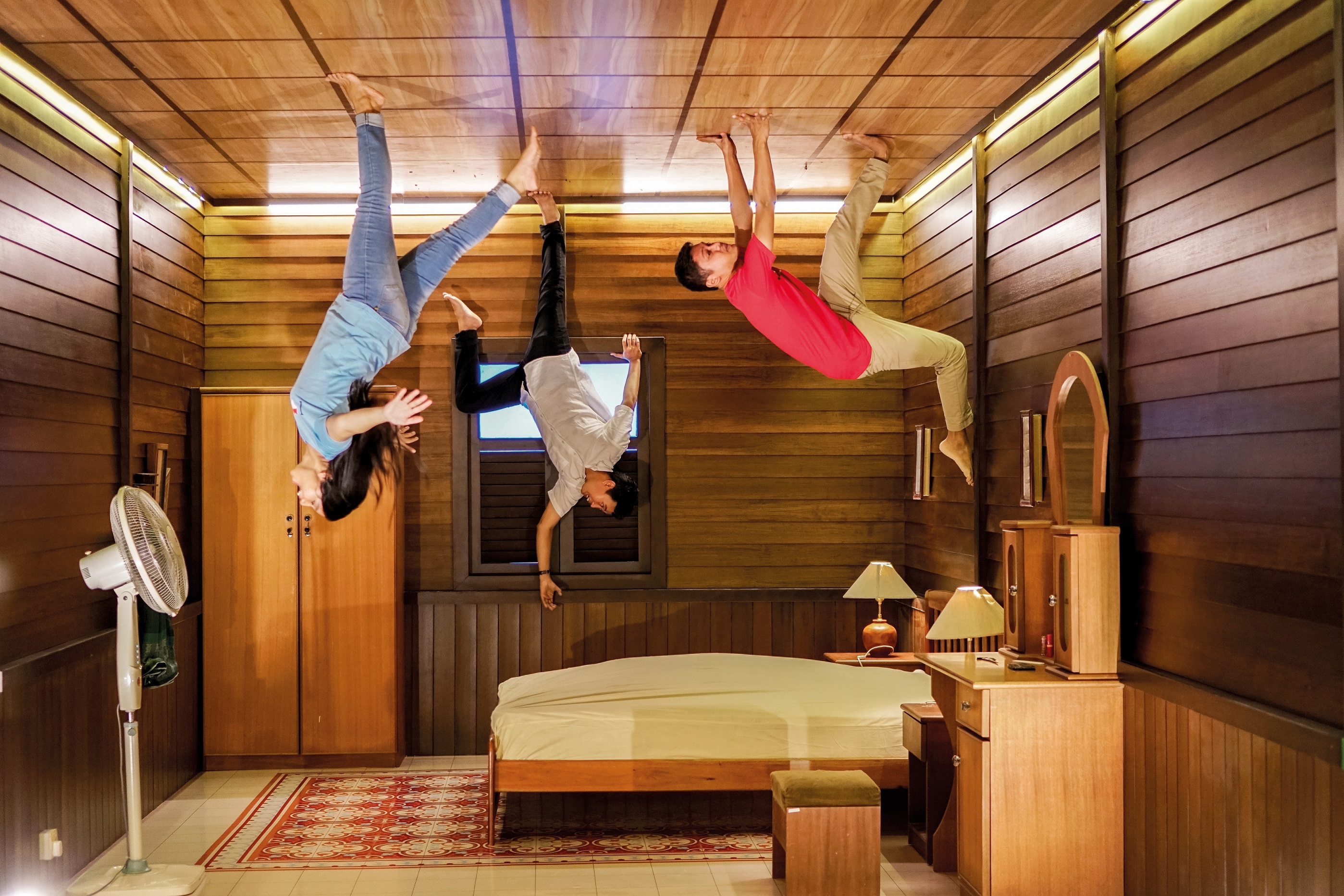 Step into a world where gravity defies logic and capture playful moments in a traditional Malay setting. Explore unique perspectives and let creativity soar amidst stunning illusions.