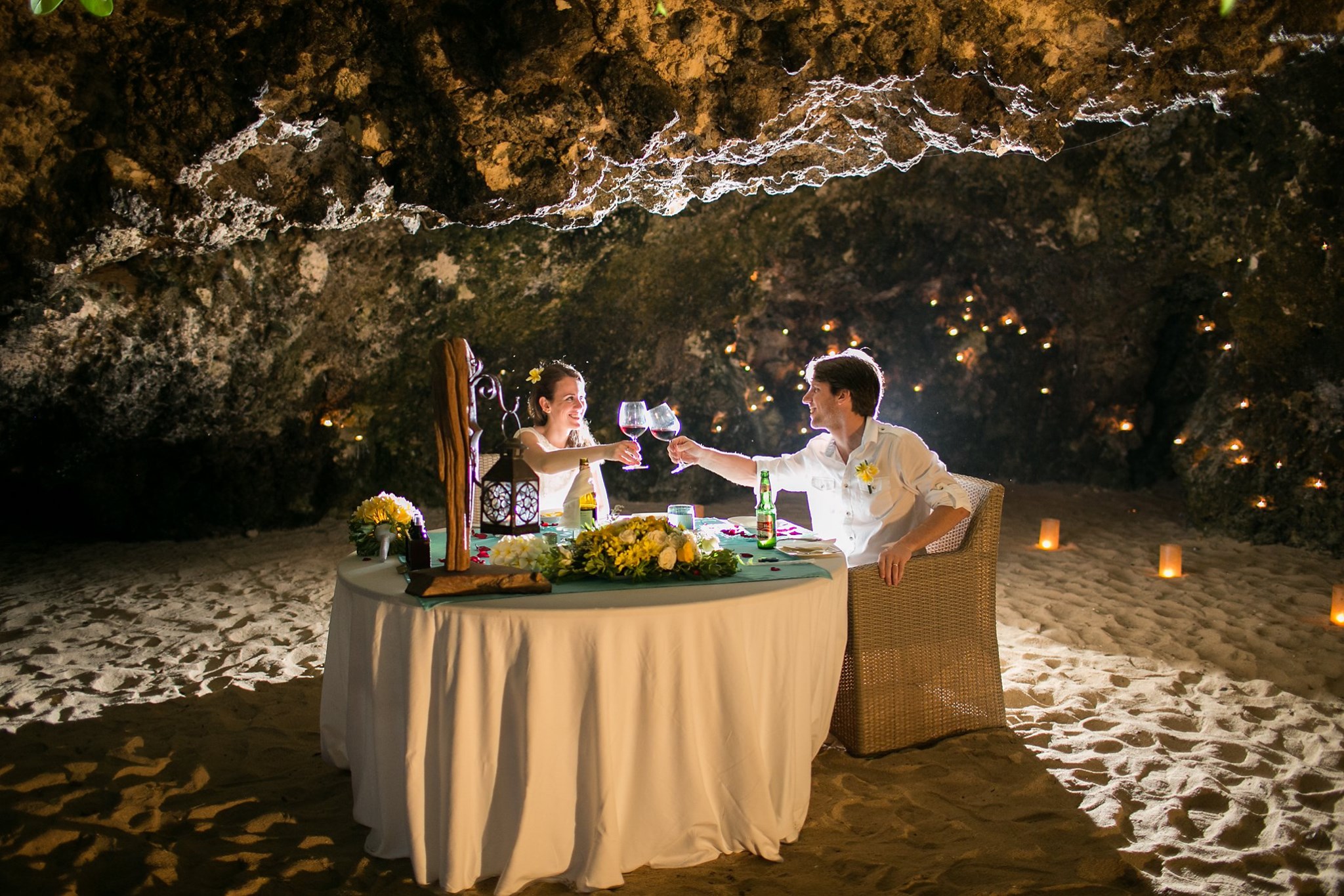 Dine under a stunning natural cave surrounded by soft sand as gentle sea breezes enhance your special evening with delightful gourmet dishes and a romantic setting at Samabe Bali.