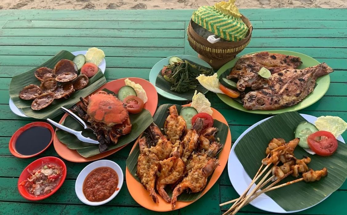 Savor the taste of freshly caught seafood at Melati Bali Cafe where each dish reflects the rich flavors of Bali set against a stunning seaside backdrop that enhances every bite.