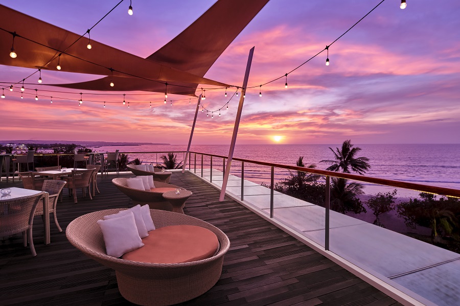 Relax in stylish seating as the sun sets over Bali with ocean views and the gentle sound of waves creating the perfect backdrop for unforgettable meals and drinks.