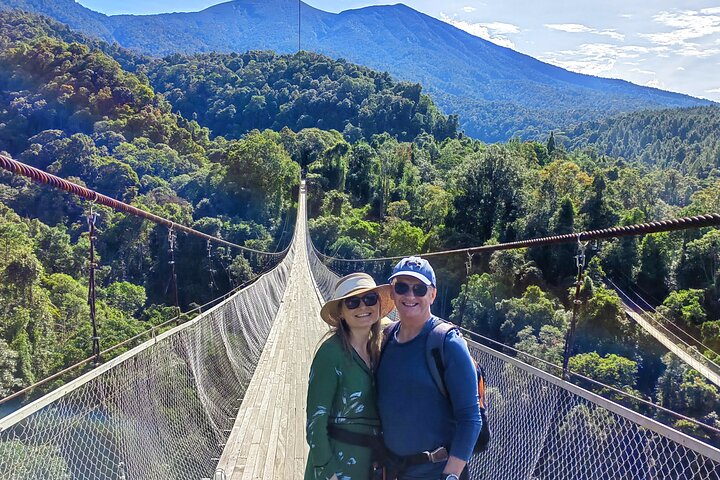 Experience the breathtaking views from Situ Gunung Suspension Bridge where lush greenery meets majestic mountains inviting adventure and exploration in the heart of West Java’s natural wonders.