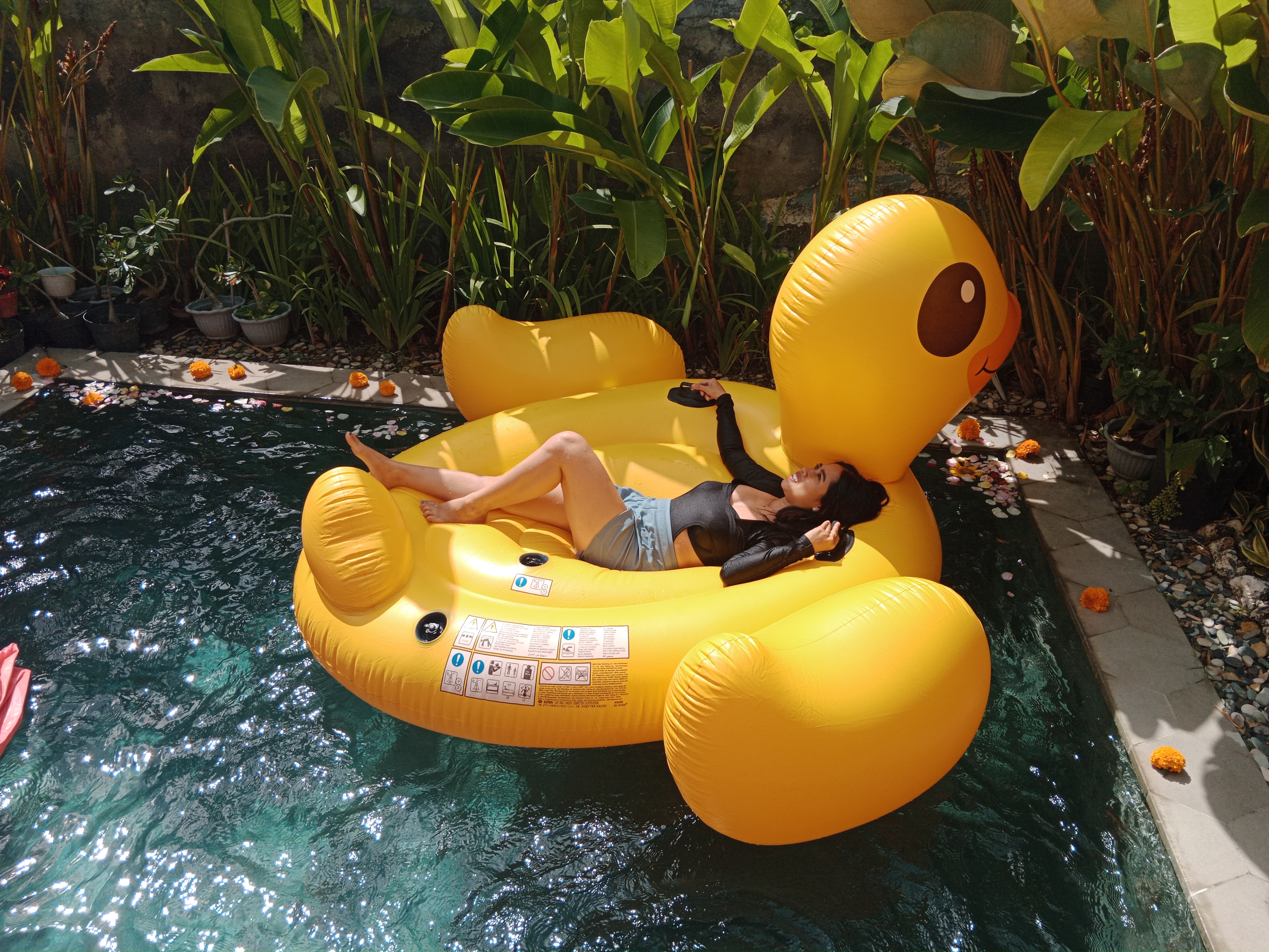 Float away on a whimsical yellow duck while soaking up the Balinese sun. Perfect for lazy pool days and unforgettable photo moments with friends. Relax and enjoy this tropical paradise.