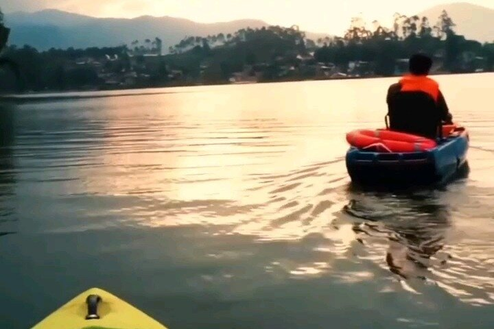 Experience the serene beauty of Situ Cileunca Lake as you kayak through calm waters surrounded by majestic mountains and the tranquil sounds of nature. Adventure awaits!