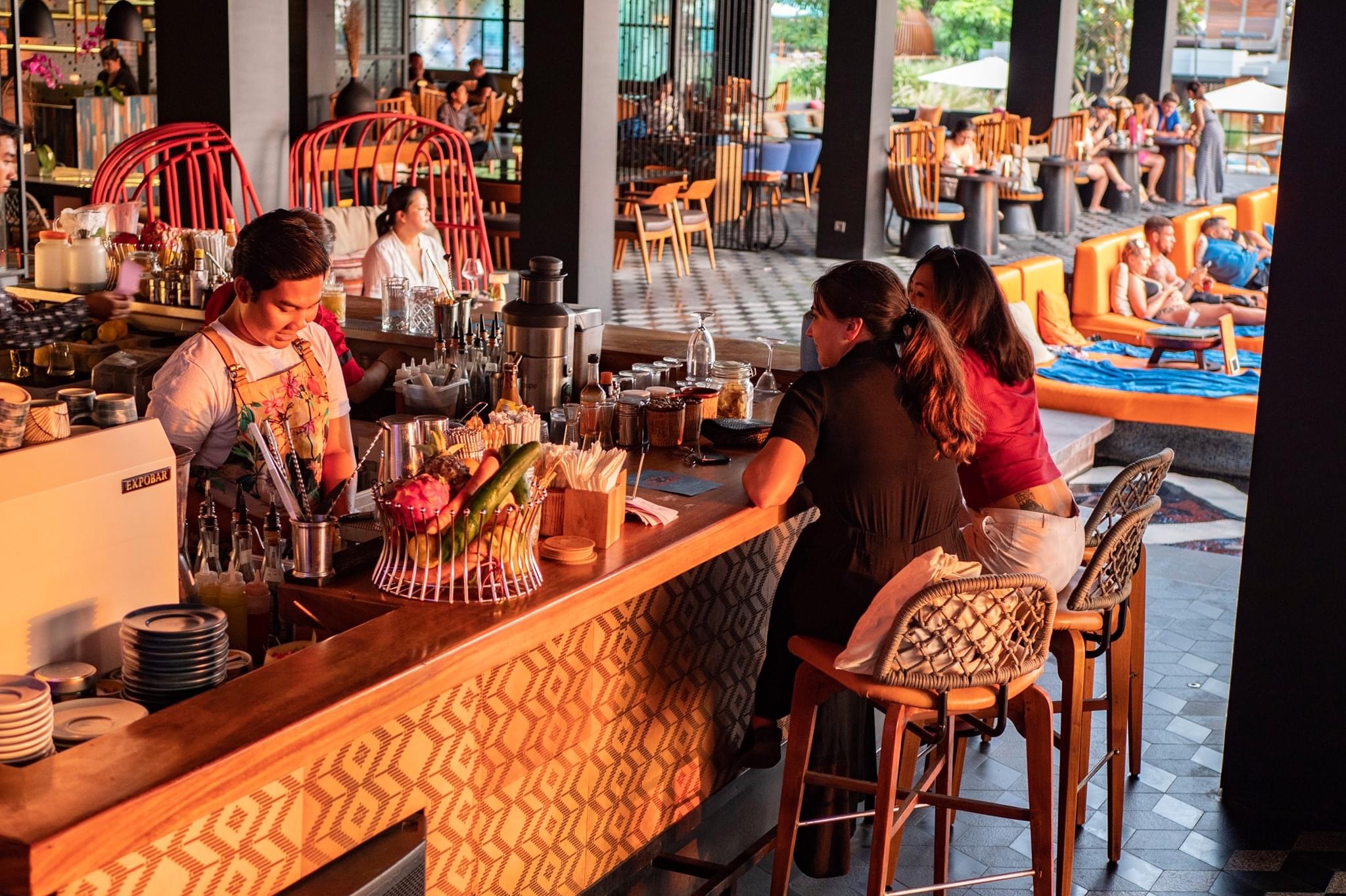 Savor the essence of Bali at SugarSand where exquisite flavors await alongside stylish decor. Enjoy a cocktail by the pool and indulge in delightful culinary creations with friends.