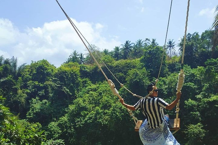 Swing high above lush greenery and enjoy stunning views in Bali at D’Tukad River Club. Capture unforgettable moments in a unique treehouse setting and relax by the poolside.
