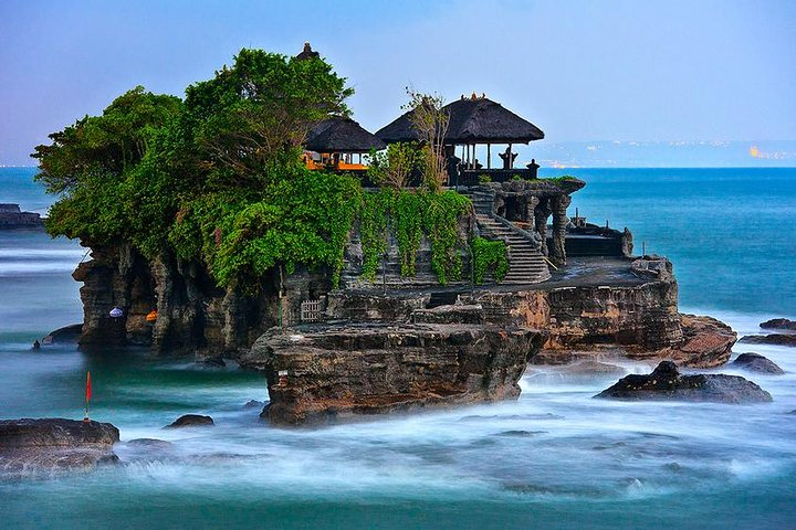 Discover the serene beauty of Tanah Lot a temple perched on rocky shores where the waves kiss the land creating perfect moments for photography and connection with nature.