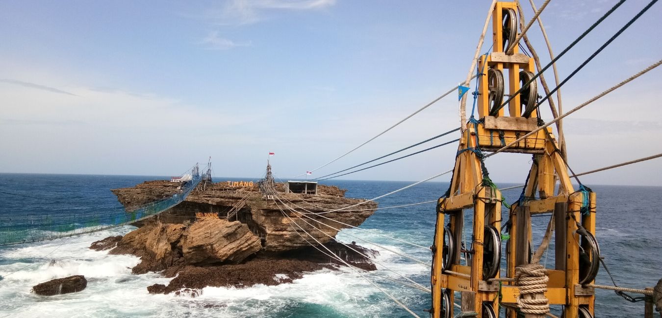 Embrace the raw beauty of Timang Beach as you glide over stunning rock formations and the endless ocean while exploring the unique lobster-hunting community on Panjang Island.