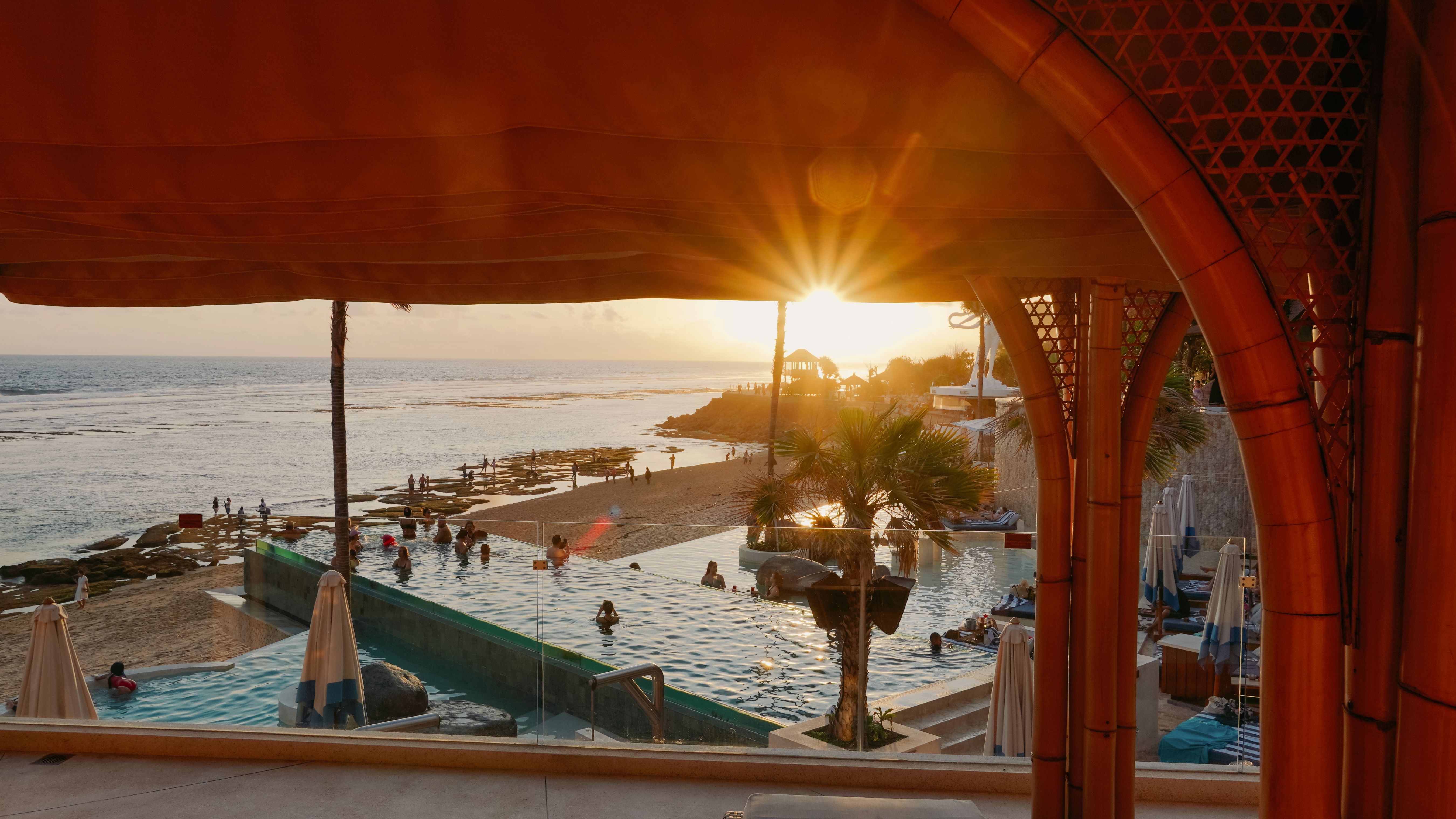 Experience stunning views of Melasti Beach as the sun sets enjoying signature cocktails and locally inspired dishes by the pool while a live DJ enhances the beachside vibe.