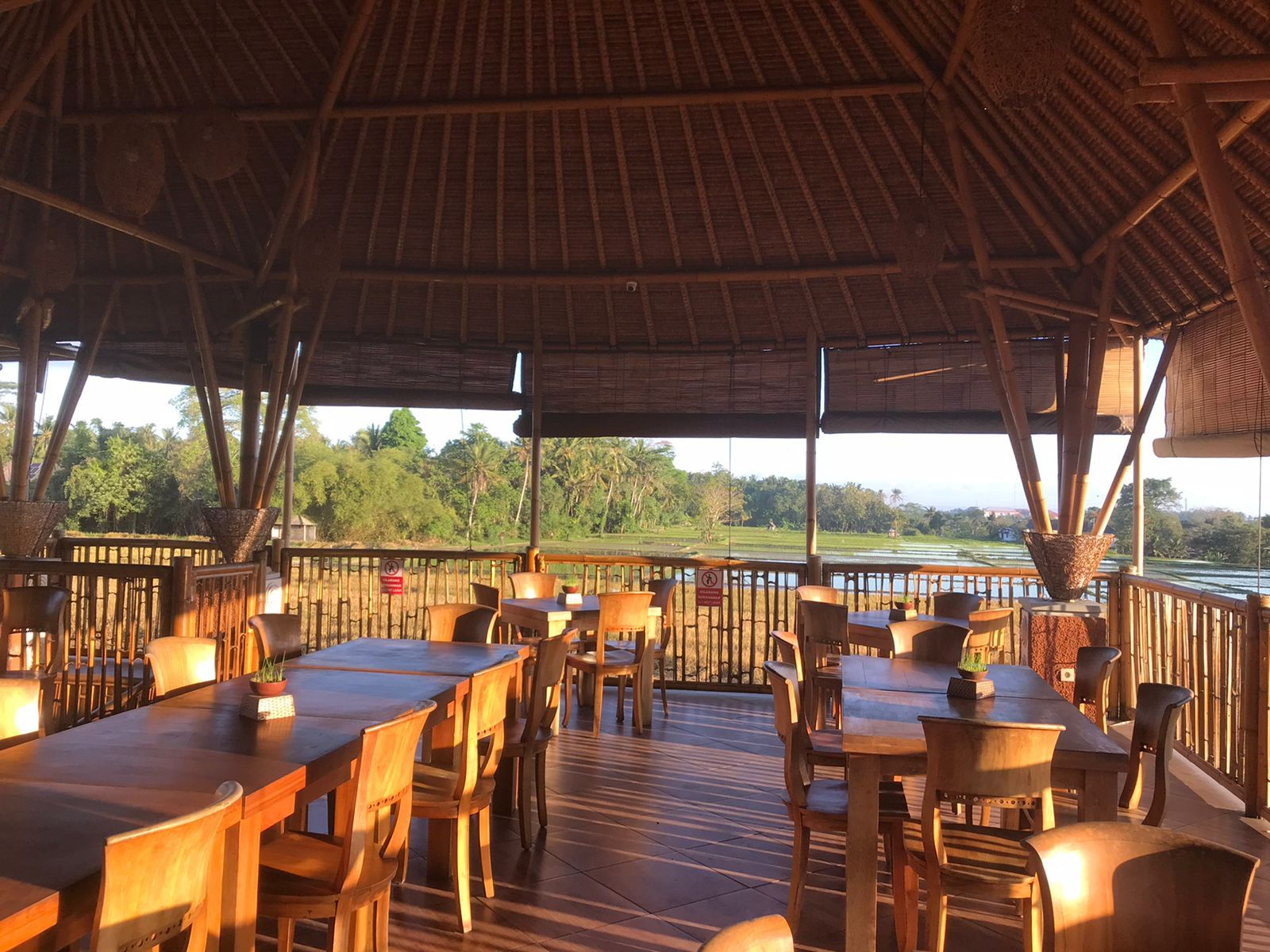 Nestled among lush greenery Bebek Tebasari Resto offers a serene dining experience where traditional Balinese flavors come alive perfect for savoring your meal while enjoying stunning views.