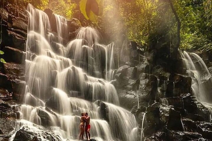 Explore the stunning beauty of serene waterfalls where the rush of water and lush surroundings create a perfect backdrop for unforgettable memories in Ubud's natural wonders.