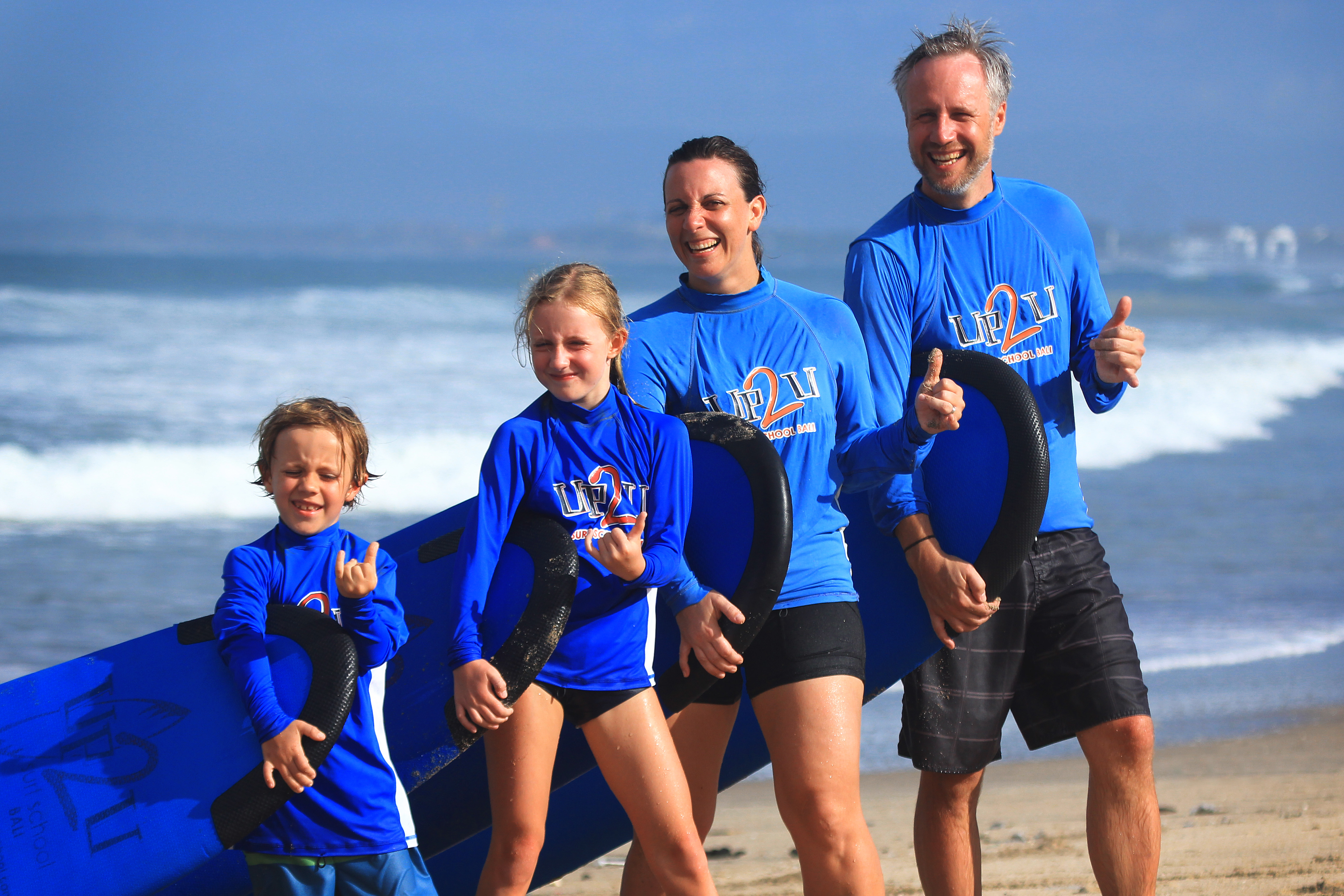 Experience the joy of surfing as a family at Kuta Beach Bali where expert instructors guide all ages in mastering the waves and embracing the ocean's energy together.
