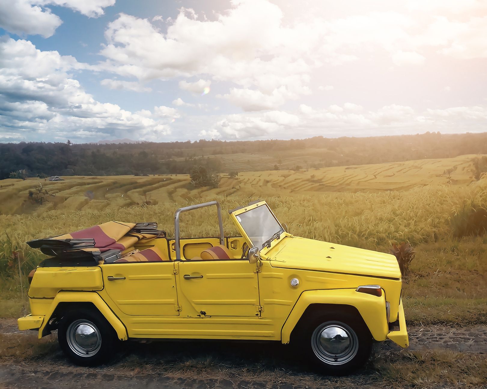 Cruise through Bali’s stunning landscapes in a vintage VW Safari convertible wagon uncovering Ubud's hidden gems and savoring a delicious local lunch amidst lush rice terraces.