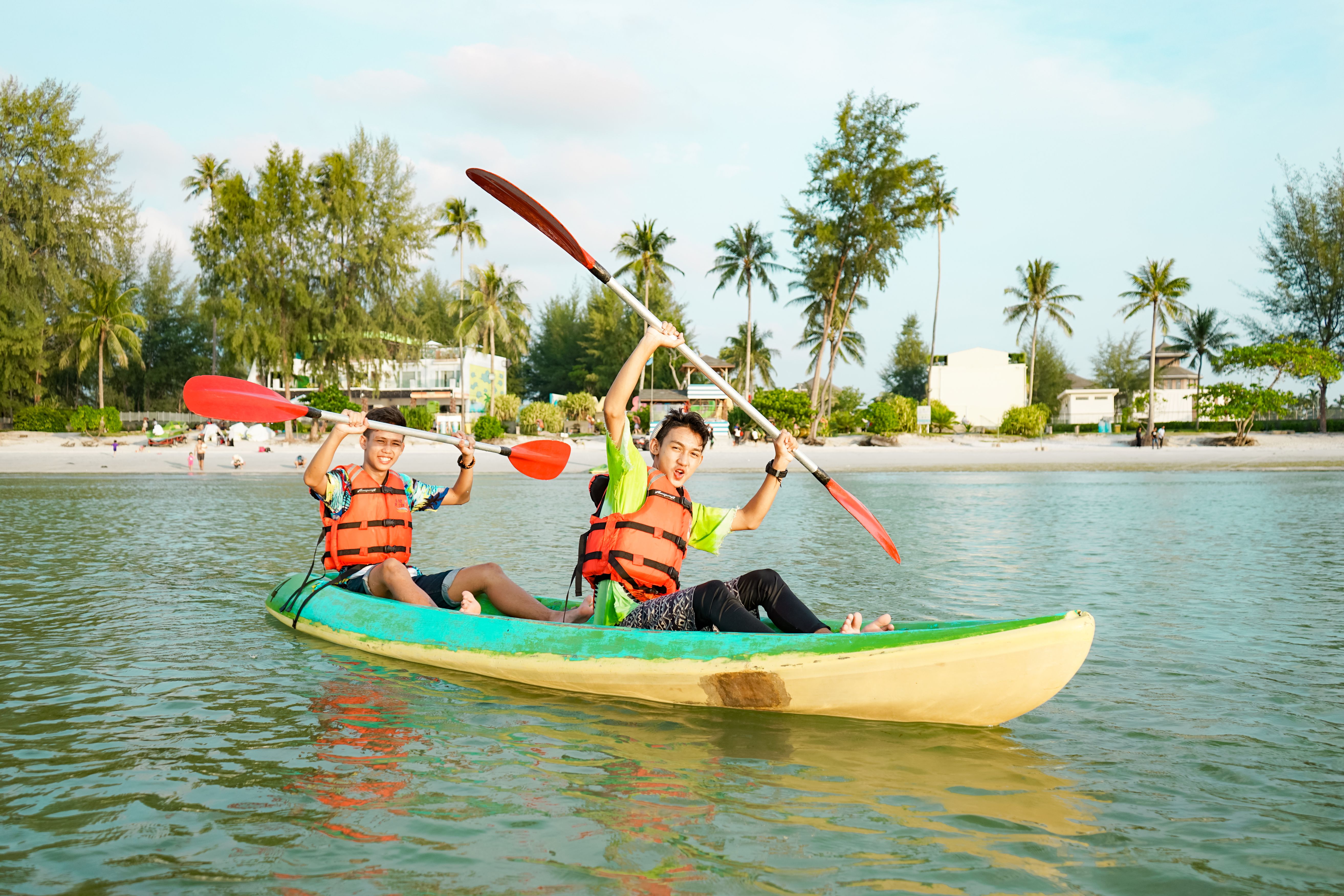 Experience the joy of kayaking at Lagoi Bay Beach where serene waters meet stunning palm-fringed shores perfect for adventure seekers and those looking to unwind.